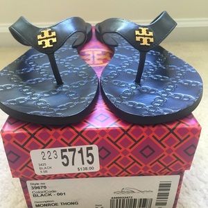 Tory Burch embossed leather flip flops